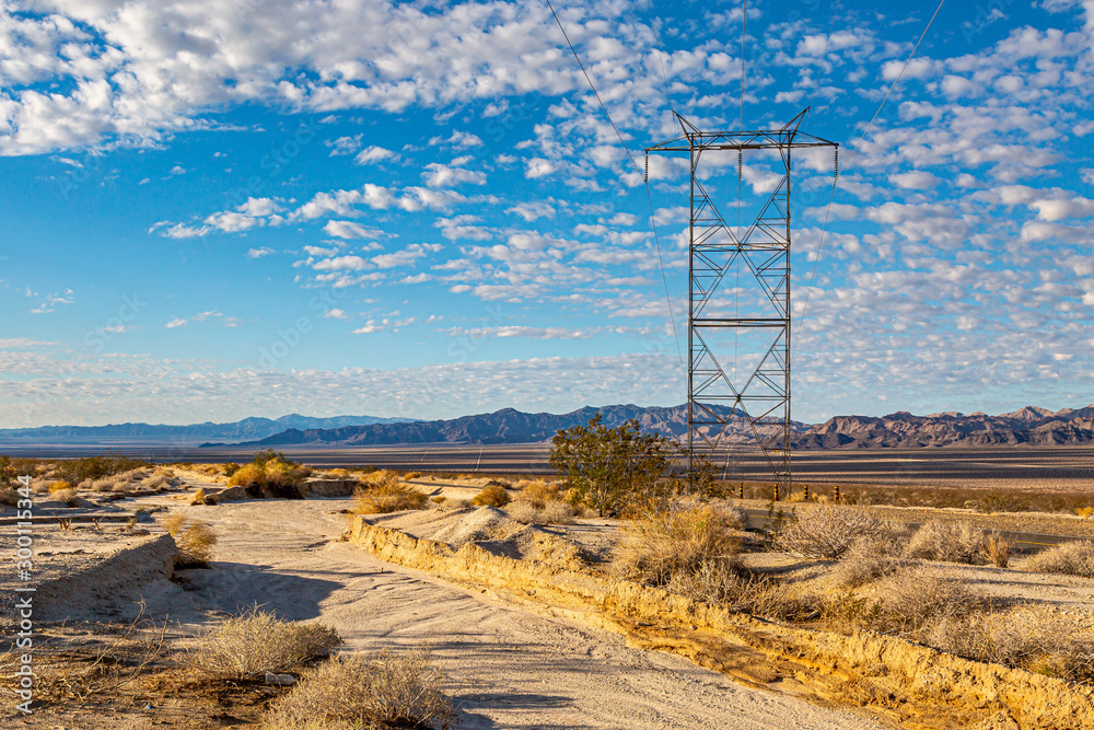 Power cables in the Californian desert, with early morning light Power cables in the Californian desert, with early morning light