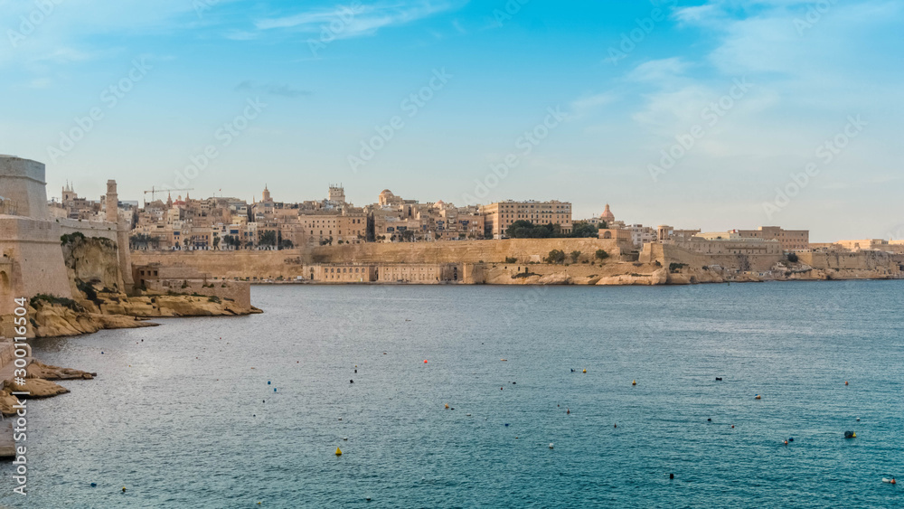 Aerial view of Valletta skyline, Vittoriosa fortress, and bay at sunny day
