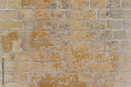 Old building bricks wall made of limestone