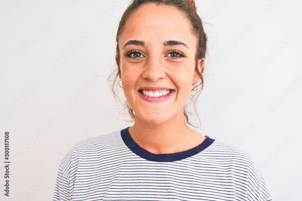Young redhead modern woman wearing a bun over isolated background with a happy face standing and smiling with a confident smile showing teeth Young redhead modern woman wearing a bun over isolated background with a happy face standing and smiling with a confident smile showing teeth
