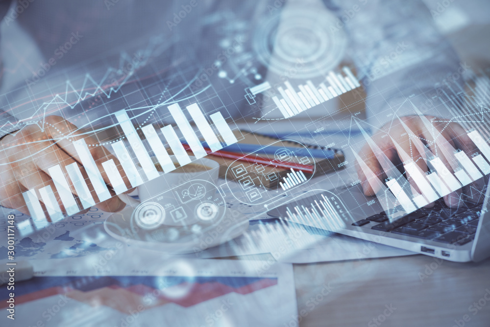 Forex graph with businessman working on computer in office on background. Concept of hardworking. Double exposure. Forex graph with businessman working on computer in office on background. Concept of hardworking. Double exposure.