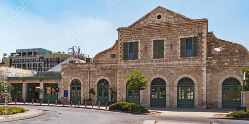 front of the tahanah rishonah first train station in central jerusalem in israel with modern buildings in the background