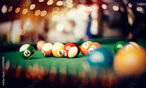 Colorful billiard balls on a billiard table. photo
