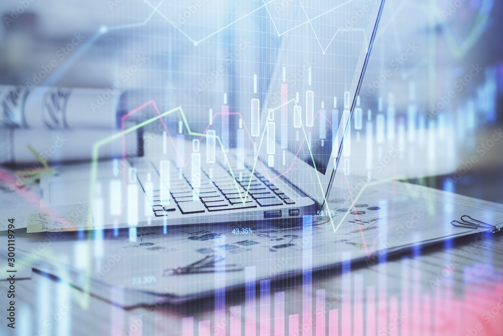 Stock market graph on background with desk and personal computer. Double exposure. Concept of financial analysis. Stock market graph on background with desk and personal computer. Double exposure. Concept of financial analysis.