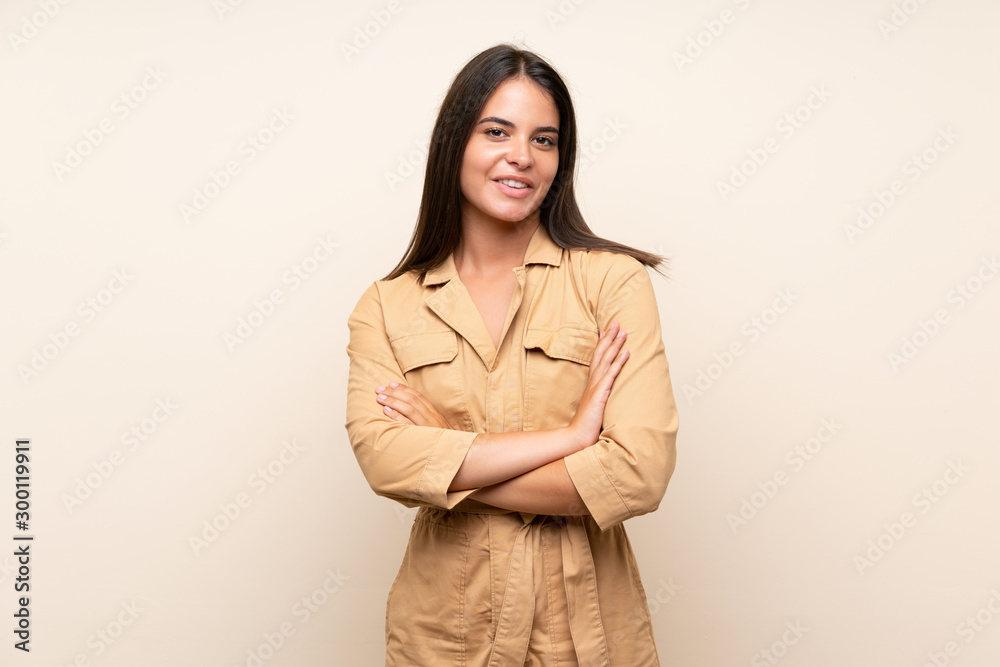 Young girl over isolated background keeping the arms crossed in frontal position Young girl over isolated background keeping the arms crossed in frontal position