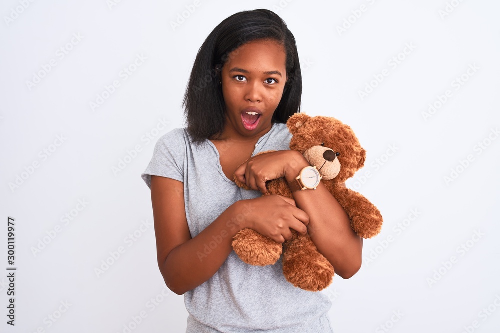 Girl holding sales teddy bear