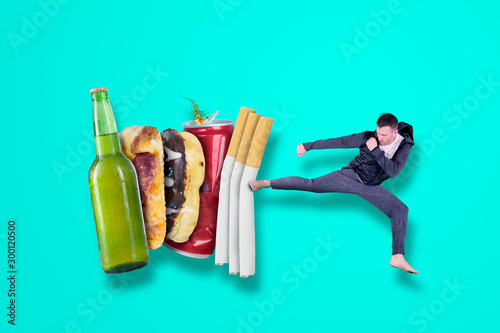 Photography Caucasian man kicking his bad habit on studio