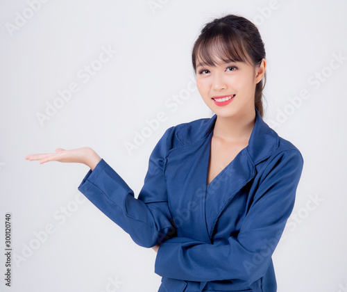 Beautiful portrait young asian business woman presenting and showing with confident isolated on white background, asia secretary or adviser businesswoman hand palm with empty for advertising concept.