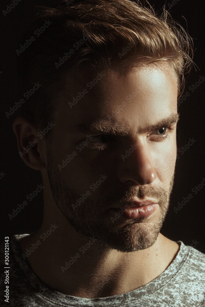 Muscle strong beautiful stripped male model with black t-shirt in denim blue jeans on black isolated font background Muscle strong beautiful stripped male model with black t-shirt in denim blue jeans on black isolated font background