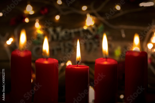 Close up of candles with blurred Christmas light