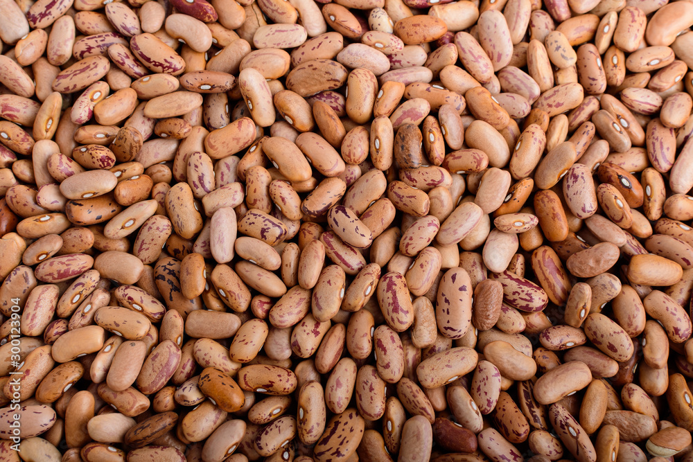 Natural background of many fresh organic red beans in warm light, top view or flat lay of healthy food Natural background of many fresh organic red beans in warm light, top view or flat lay of healthy food