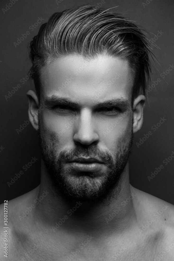 Black and White Muscle strong beautiful stripped male model in casual cloath on black isolated font background Black and White Muscle strong beautiful stripped male model in casual cloath on black isolated font background