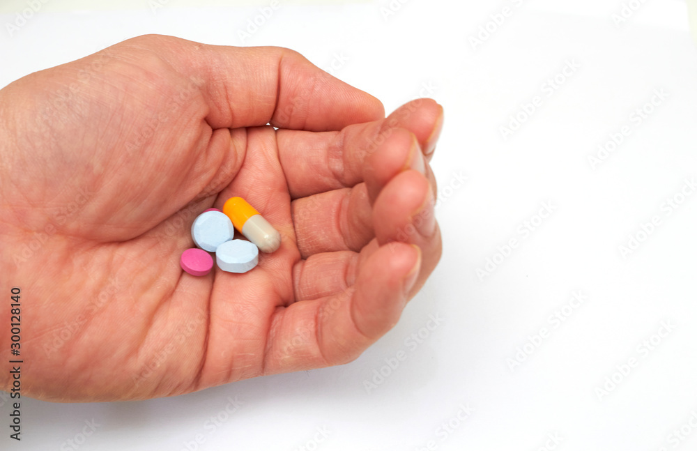 Hand holded medical pills before oral take in medical healthcare consumption concept with copy space Hand holded medical pills before oral take in medical healthcare consumption concept with copy space