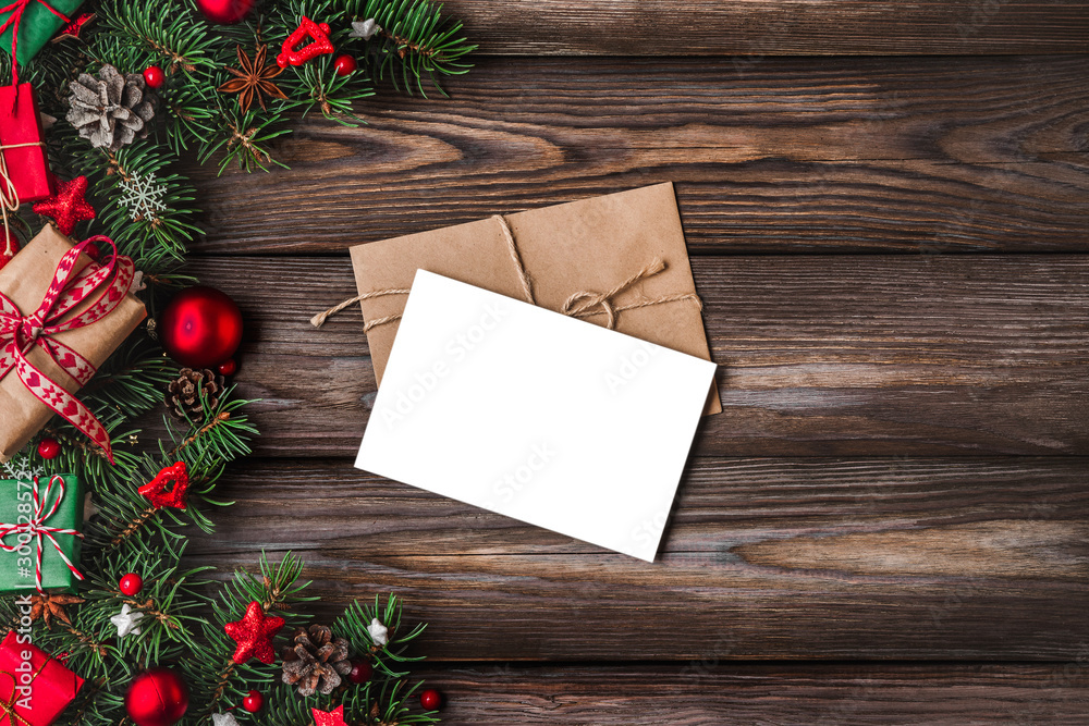 Fototapeta premium Christmas and Happy New Year greeting card with fir tree branches, gift boxes, red holiday decorations