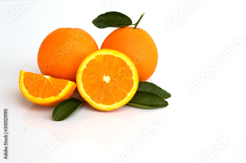 oranges with leaves isolated on white background