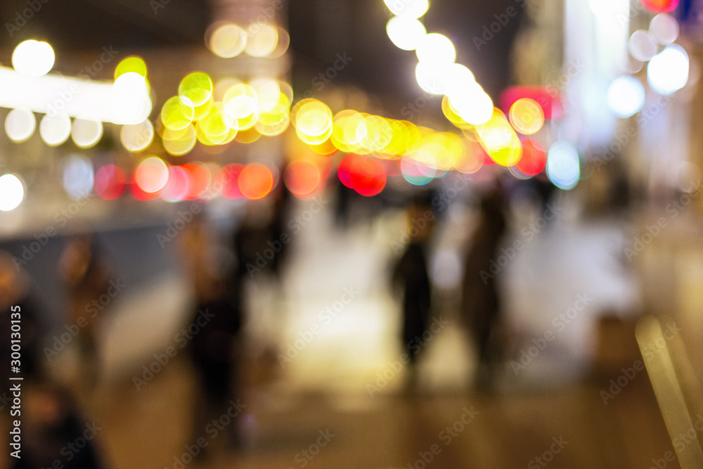people crowd on the street blurry at night. night motion