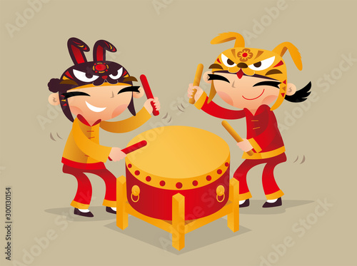 Two Chinese kids playing drum to celebrate Chinese New Year coming