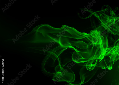 Green smoke abstract on black backgroud, darkness concept