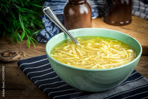 Broth - chicken soup in a bowl.