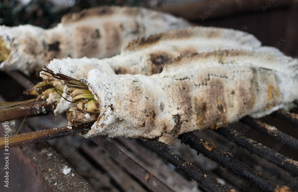 grill fish with salt on iron rack outdoor hot fire grill fish with salt on iron rack outdoor hot fire