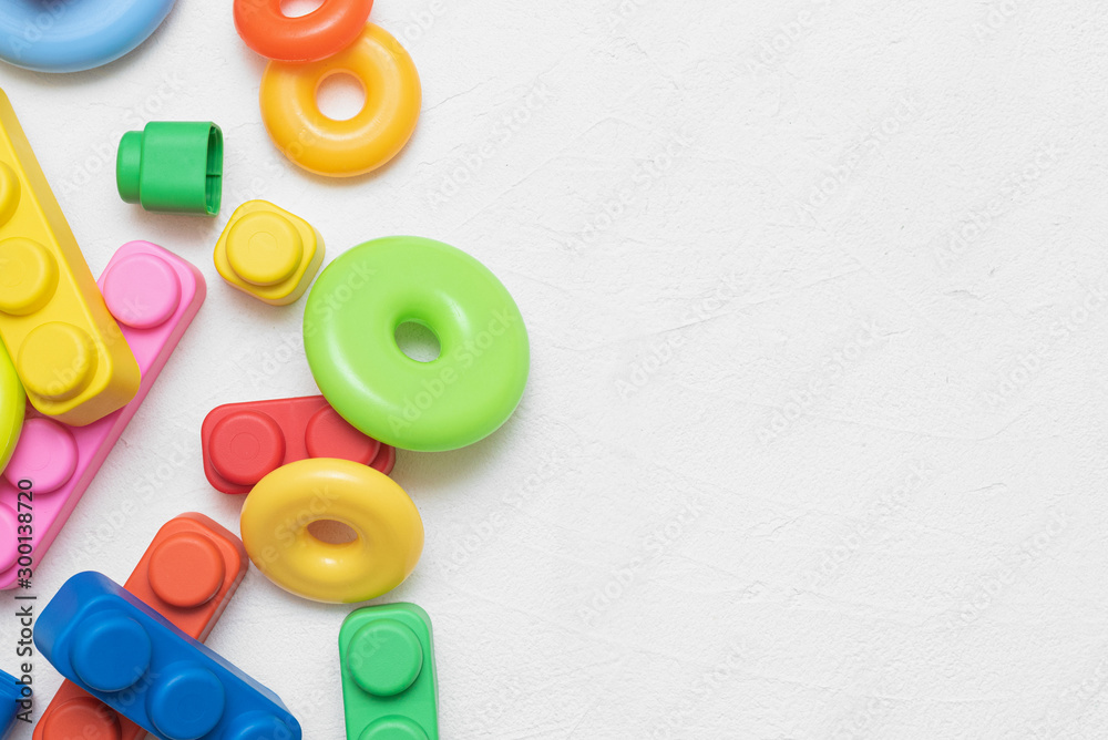 Fototapeta premium Baby toys flat lay background with copy space.