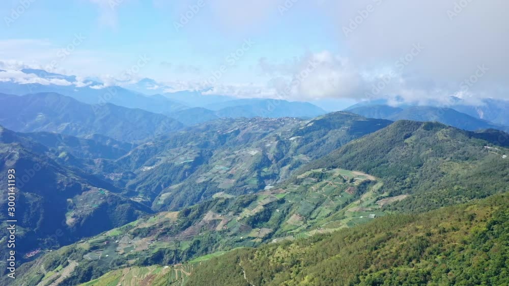 Drone flying toward through the beautiful Mt.Hehuan, Hehuanshan, in Taiwan Central Mountain range, with flowing cloud sea and blue sky, aerial view. Drone flying toward through the beautiful Mt.Hehuan, Hehuanshan, in Taiwan Central Mountain range, with flowing cloud sea and blue sky, aerial view.