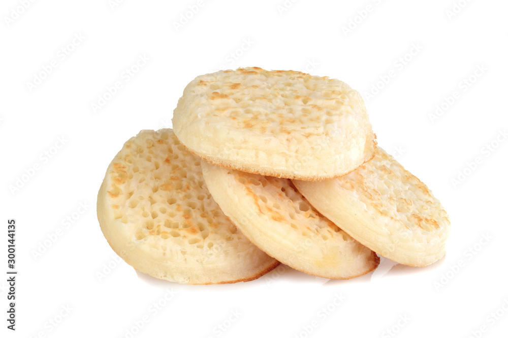 pile of english crumpets on white