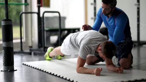 Personal Trainer with young man