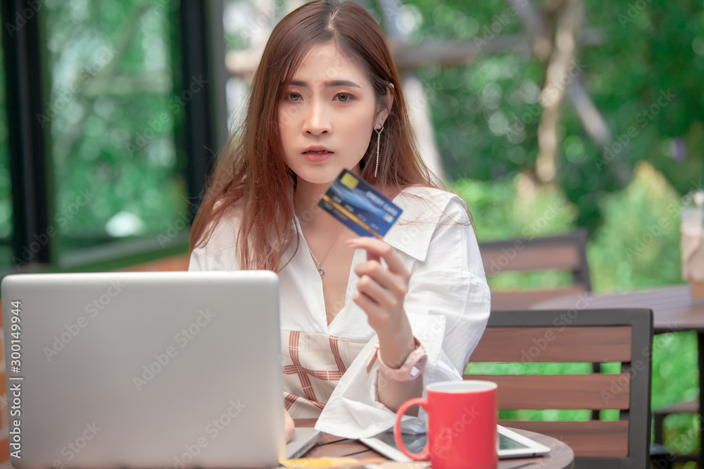 Hands holding credit card and using laptop. Online shopping Hands holding credit card and using laptop. Online shopping
