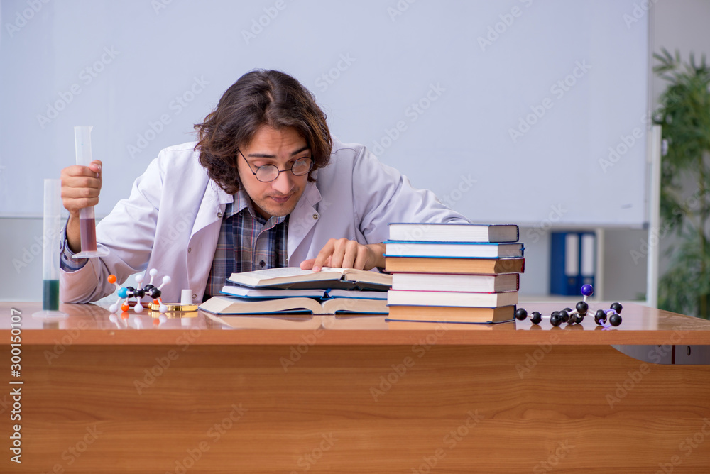 Chemistry lecturer during lecture in college Chemistry lecturer during lecture in college