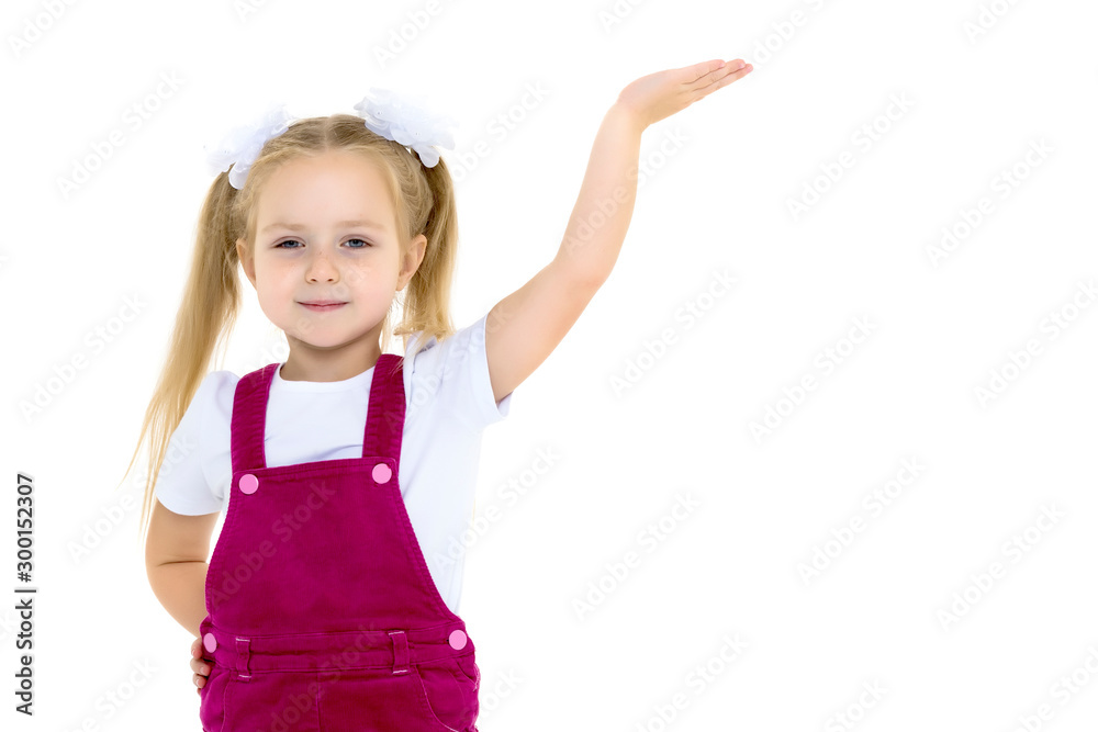 Little girl posing in studio on a white background. Little girl posing in studio on a white background.
