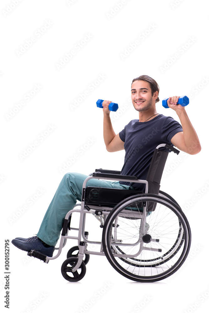 Young disabled man doing physical exercises isolated on white Young disabled man doing physical exercises isolated on white