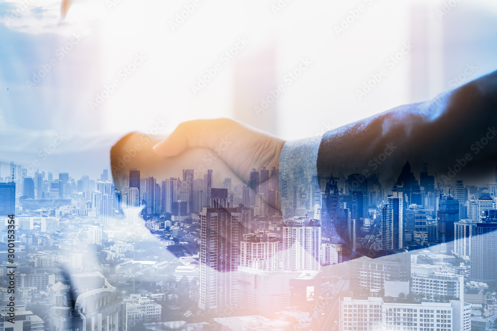 Double exposure worker hand shake teamwork brainstorming with innovation business. concept success investment.Business People Handshake Greeting Deal Concept. Double exposure worker hand shake teamwork brainstorming with innovation business. concept success investment.Business People Handshake Greeting Deal Concept.