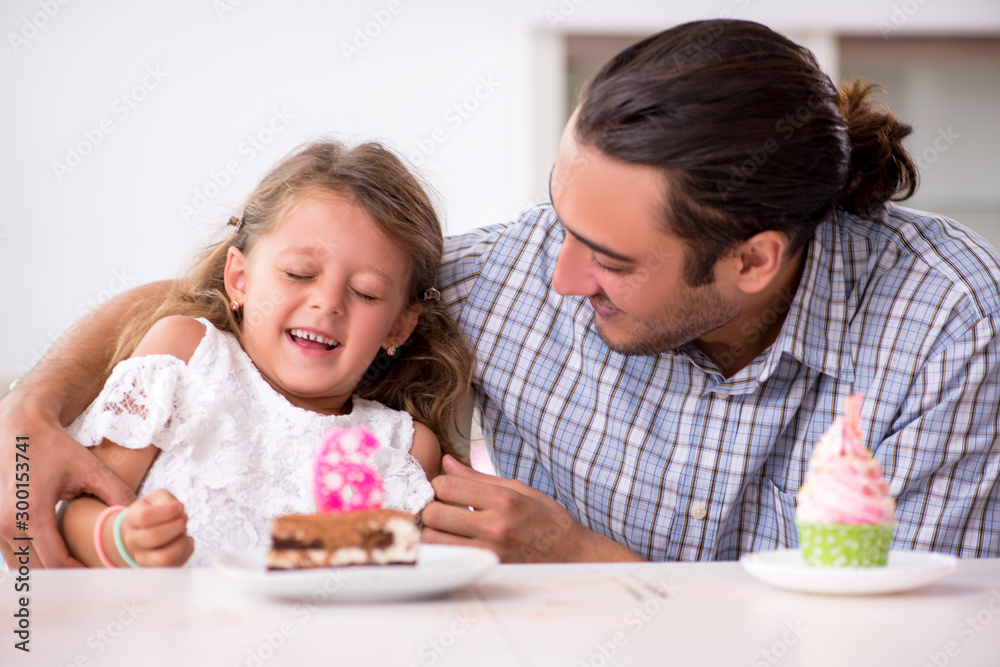 Father celebrating birthday with his daughter Father celebrating birthday with his daughter