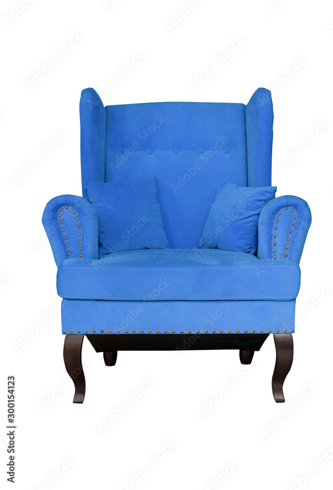 Blue soft chair with pillows on wooden legs. Upholstered furniture for the living room. Royal blue armchair isolated Blue soft chair with pillows on wooden legs. Upholstered furniture for the living room. Royal blue armchair isolated