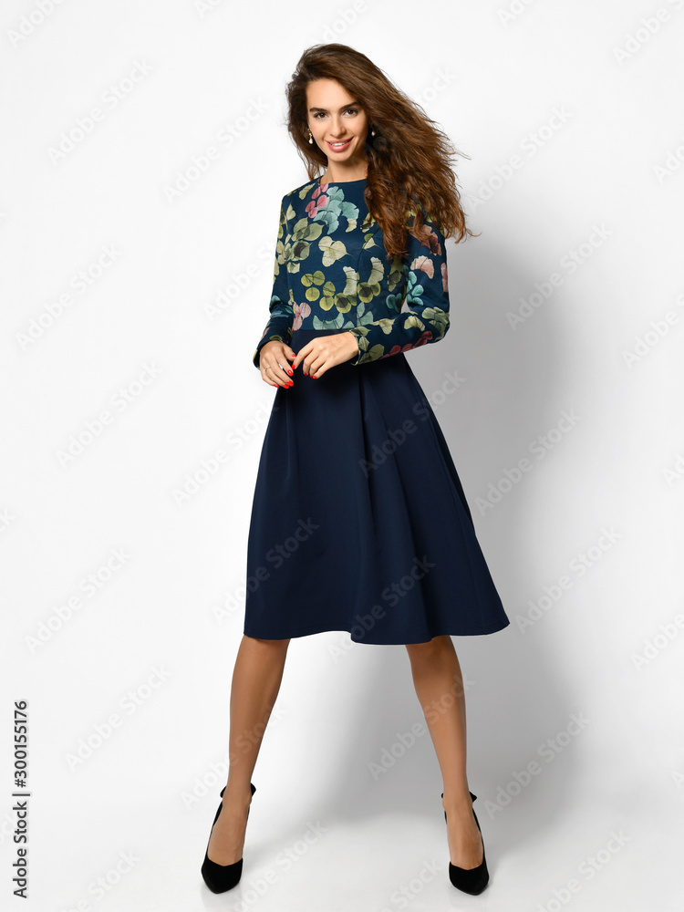 Young beautiful woman posing in new casual fashion dress full body on a white Young beautiful woman posing in new casual fashion dress full body on a white