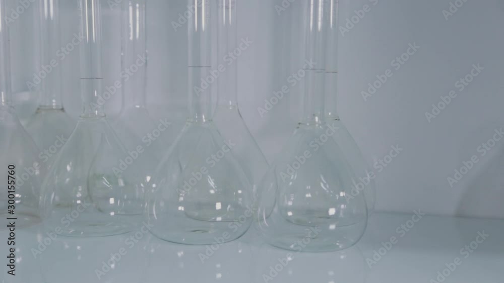 Glass test tubes in a science laboratory. Glass test tubes in a science laboratory.