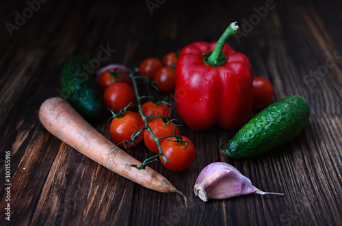 fresh vegetables lie on a wooden table, still life of vegetables in a rustic style, vegetarian food