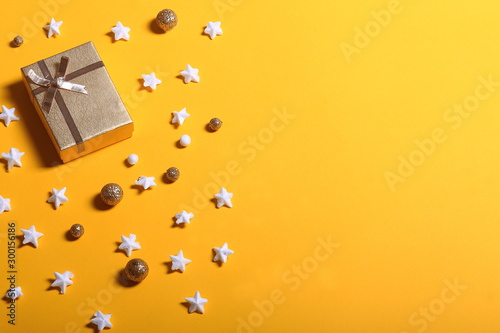 Gift box and stars on yellow background