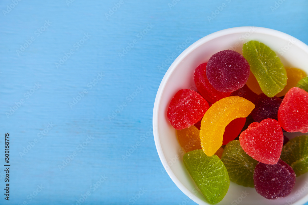 Multicolored marmalade in a bowl