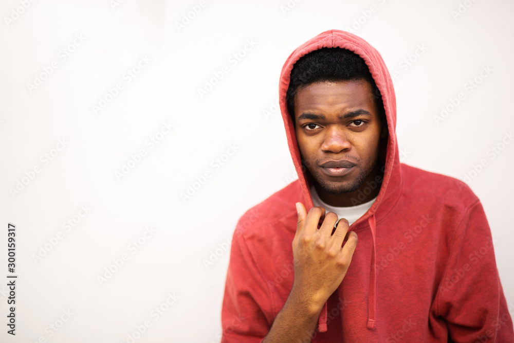 young african american man with hoodie by white background young african american man with hoodie by white background