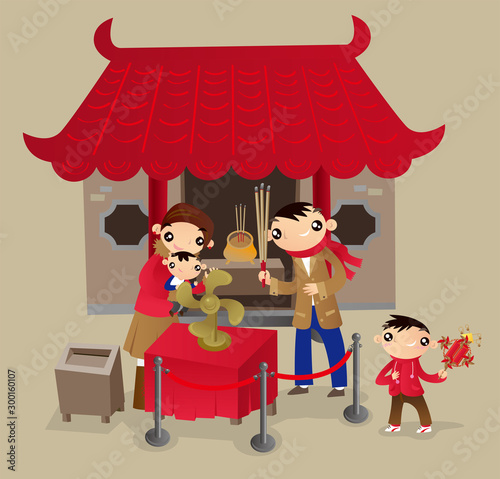 Hong Kong family go to Chinese temple during the Chinese New Year festival. Turning fan-bladed wheel of fortune for blessing good luck in coming year.