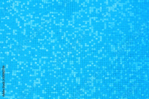 blue clear water of swimming pool with mosaic bottom