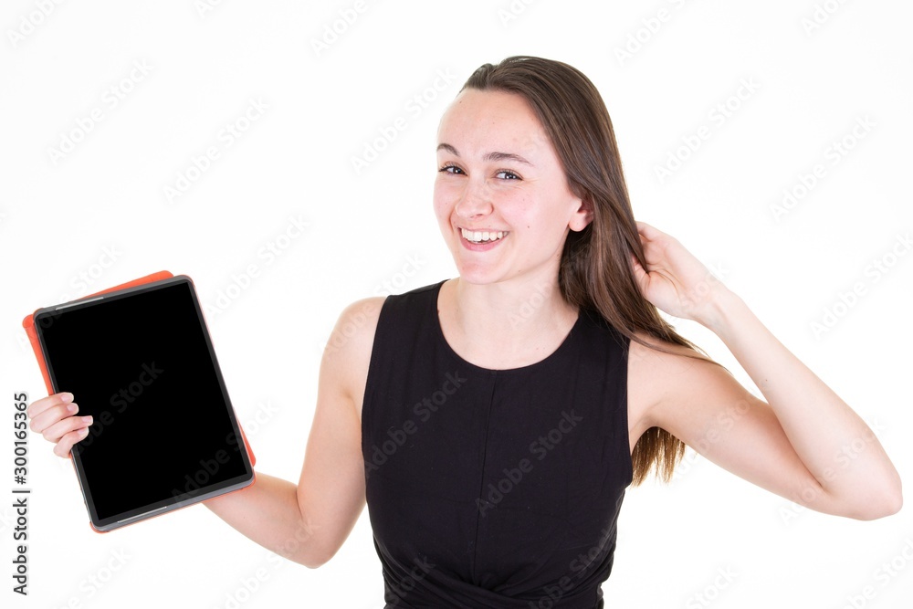 © OceanProd - Smiling Young woman Showing Empty Tablet Screen in Studio Shot © OceanProd - Smiling Young woman Showing Empty Tablet Screen in Studio Shot