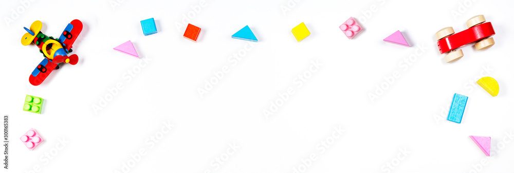 Baby kids toys on white banner background. Top view, flat lay. Copy space for text