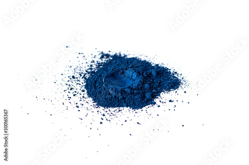 Natural blue color matt pigment. Loose cosmetic powder. Eyeshadow pigment isolated on a white background  close-up