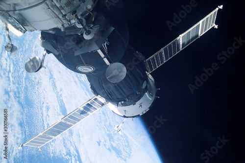 Fototapeta Naklejka Na Ścianę i Meble -  Space satellite over the planet Earth. Elements of this image were furnished by NASA.