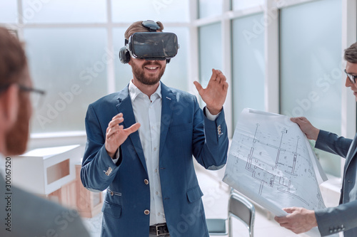 architect using virtual reality glasses in the workplace. photo