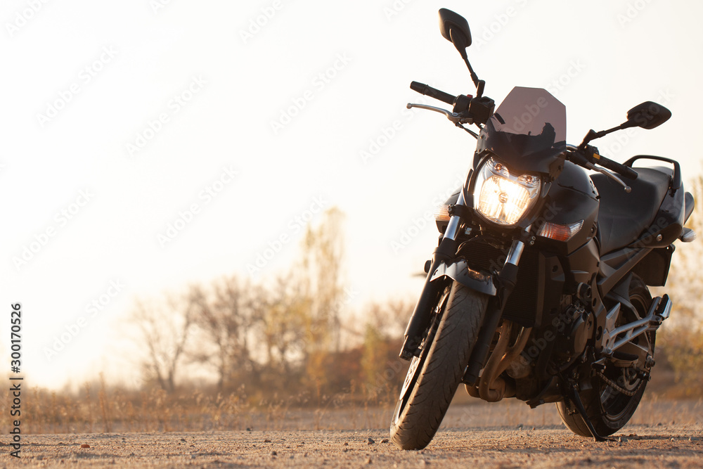 One black motorcycle in the desert. One black motorcycle in the desert.