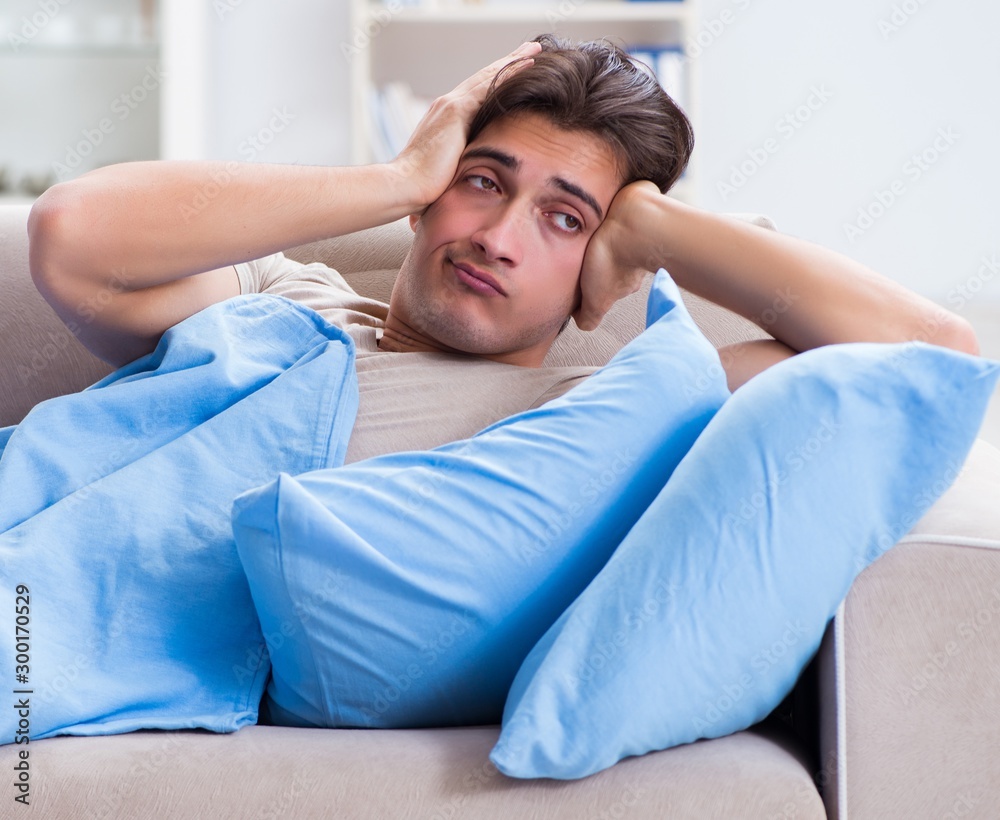 The man suffering from insonmia in bed at home The man suffering from insonmia in bed at home